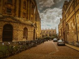 cars parked on a street in england