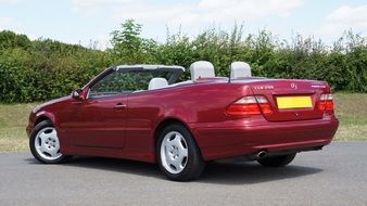 red convertible mercedes benz in the parking lot