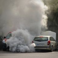 photo of two cars in big smoke