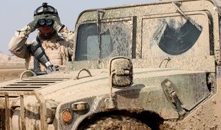 soldier and dirty Jeep