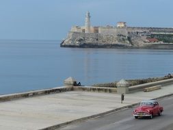 Landscape with the car and lighthouse, cuba, Havana