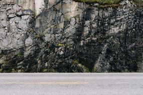 rocks along the asphalt road