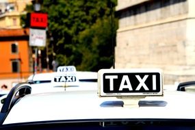 White roofs of Taxi cabs with signs, italy, Rome