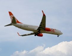 white-orange plane in flight