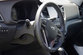 closeup picture of Steering wheel on a toolbar in a car