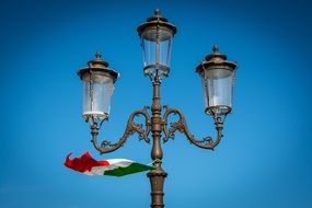 Flag of italy on Street Lamp post at sky
