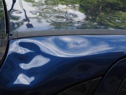 car with hail dents