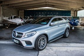 Gray Mercedes Benz in a parking lot