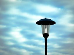 old street Lantern with Lamp at Clouds