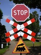 stop sign at a railway crossing