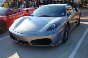 silver ferrari car in the parking lot