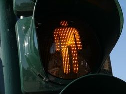 man at orange traffic light