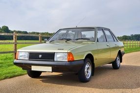 Classic shiny Talbot Solara near the colorful field