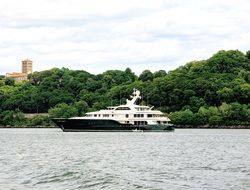 distant view of a luxury yacht on the water in new york