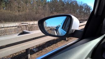 view of traffic in the side view mirror