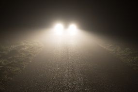 included car lights on the road at night