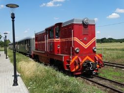 Colorful train on the railway tracks