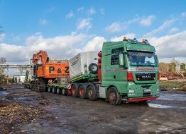 A truck with a heavy load on the road