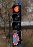 traffic sign on a traffic light with a red signal