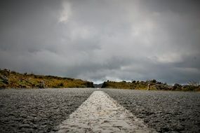 Road Without End beneath Cloudy sky