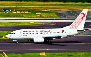white passenger plane on the runway