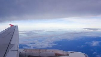 Airplane on a cloudy sky