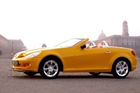 yellow car on the road