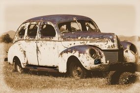 Old photo of the vintage rusty car