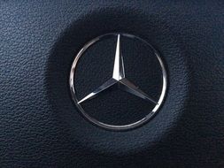 Mercedes sign on the steering wheel