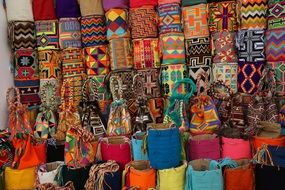 multi-colored bags in the street market