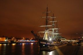 ship stands in harbor at night