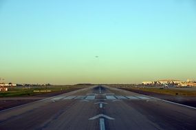 airport runway in the evening with colorful sunset