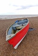 red boat on the sea coast