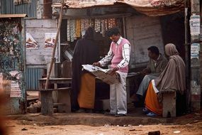 indian humans reading news paper