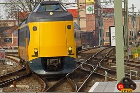 Danish yellow locomotive on rails