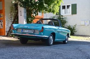 Old Renault car parked at building