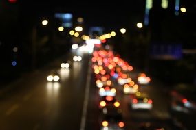 panoramic view of city traffic in the light of car headlights