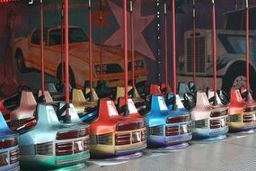 multi-colored electric cars in an amusement park