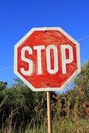 Stop, weathered Road Sign on pole