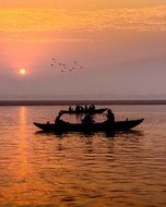 River Boat and colorful Sunrise