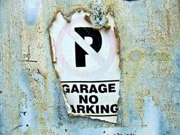 old sign prohibiting parking