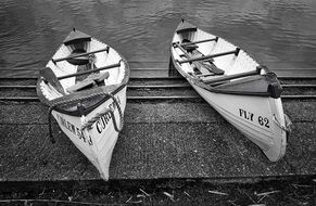 black and white photo of moored boats