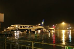 Airplane at london airport at night