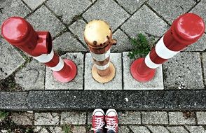 striped protective barriers at the curb