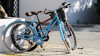 Colorful standing bicycles on sunny streets in cyprus