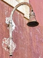 rusty street lamp on the wall