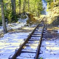 railway tracks in the winter forest