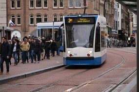 Tram on street in city, netherlands, amsterdam