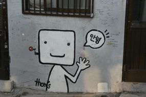 cartoon graffiti on the wall of a building in Seoul