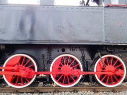 Locomotive with red wheels on the railway